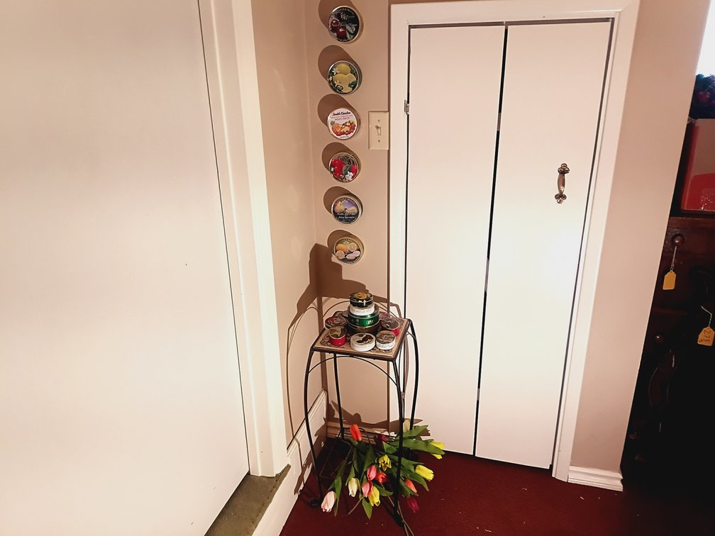 Decorative Metal Accent Table, Vintage Candy Tin Collection & Artificial Tulips