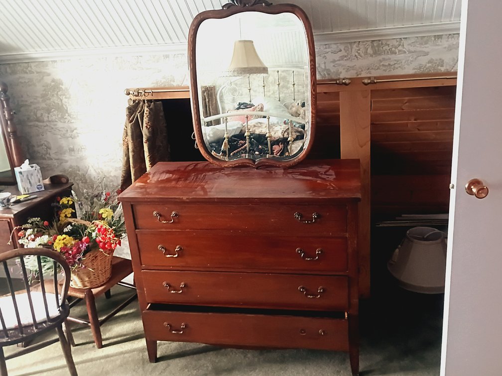 Vintage Wooden Four-Drawer Dresser with Decorative Mirror