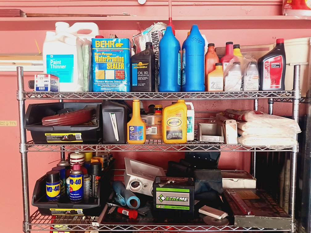 Large Garage & Automotive Supplies Lot – Oils, Lubricants, Gas Cans, Battery & Tools