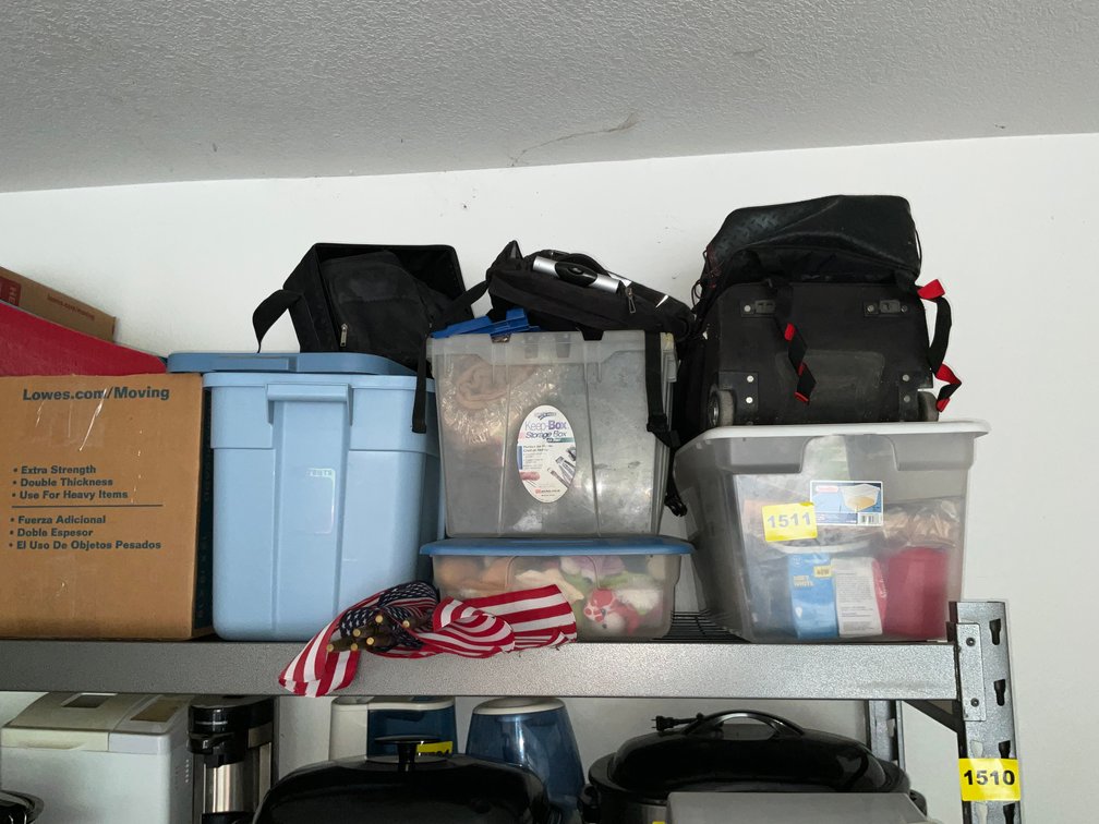 7 Boxes And Contents On Top Of Shelving- Back Packs, Dog Toys, Christmas Decor, Camping Dishes, Ect