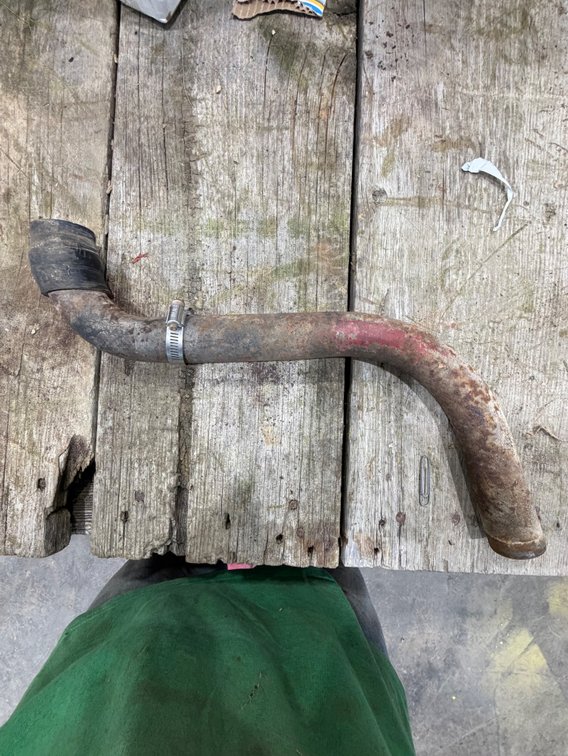 Original Ford 9N-2N Air Cleaner-to-Carburetor Pipe - Location: Joel's Tractors & Auction - Strawberry Pt, IA.