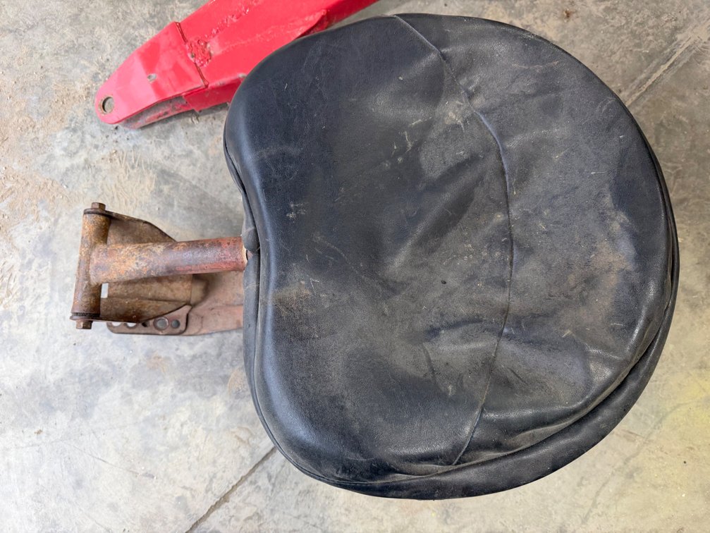 Farmall M-H Tractor Easy-ride Seat with Cushion - Location: Joel's Tractors & Auction - Strawberry Pt, IA.