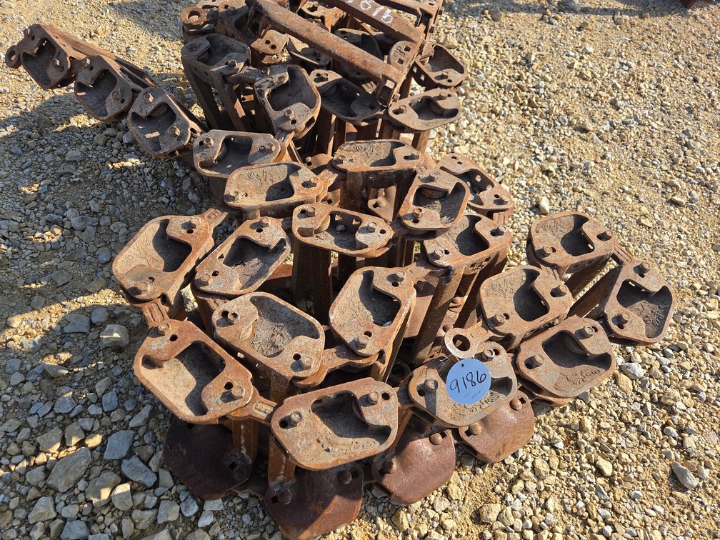 Grouser over tire skid steer tracks.
