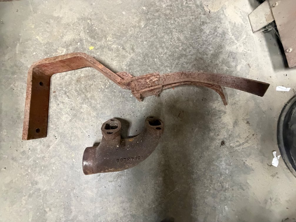 International Inside Disc Open Scraper/Press Wheel Scraper and IH Cast Exhaust Elbow - Item Location: Joel's Tractors and Auction, LLC-33587 Hwy. 13 -Strawberry Point - IA - 52076