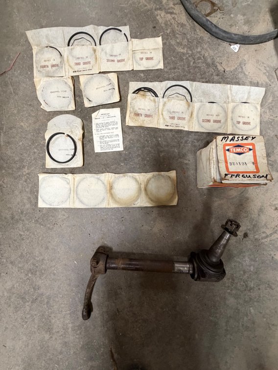 New old Stock Massey Ferguson Tractor Engine Piston Rings and Original TO30-TO20-TO35 Ferguson Left Steering Spindle - Item Location: Joel's Tractors and Auction, LLC-33587 Hwy. 13 -Strawberry Point - IA - 52076