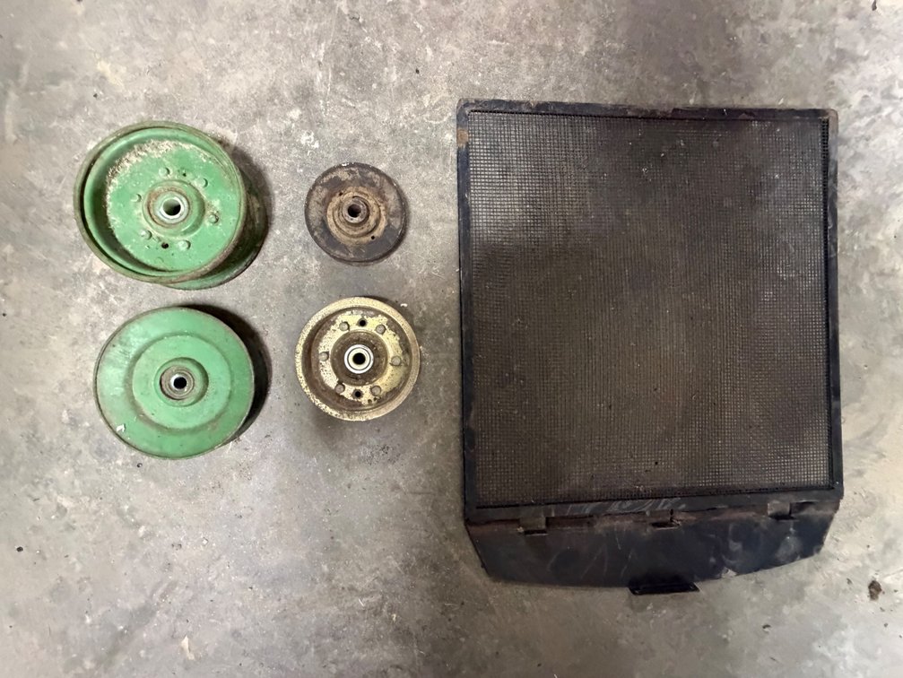 John Deere 322, 330, 332, 430 Lawn Mower Radiator Screen and 4 John Deere 111 Mower Belt Drive and Deck Pulleys - Item Location: Joel's Tractors and Auction, LLC-33587 Hwy. 13 -Strawberry Point - IA - 52076