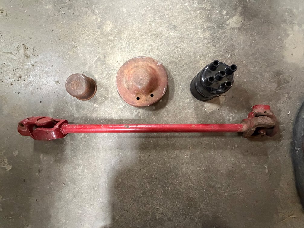 2 NOS Farmall H-M-300 Tractor 4-Cylinder Distributor Caps,  Farmall Tractor Oil Filler Breather Cap for A,B,C,200,230 & Farmall H/M Tractor Throttle Plate & Steering Column Shaft for 400, 450, 460, 560, 660, and 06/56 Series - Item Location: Joel's Tracto