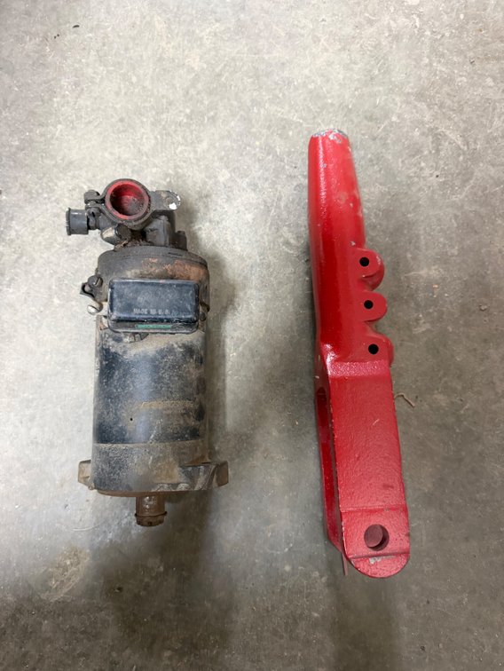 NOS Farmall 574-684-454-685-884-674 Tractor Right Leveling Screw Housing and Farmall Prestolite Tractor Orbital Motor - Item Location: Joel's Tractors and Auction, LLC-33587 Hwy. 13 -Strawberry Point - IA - 52076