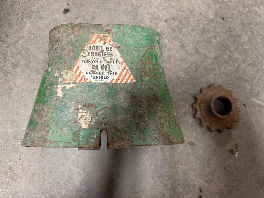Original Oliver 2-85,105,1755,1855 Tractor PTO Shield & Original Oliver 1750-1850 Tractor Hydro Power Drive Sprocket - Item Location: Joel's Tractors and Auction, LLC-33587 Hwy. 13 -Strawberry Point - IA - 52076