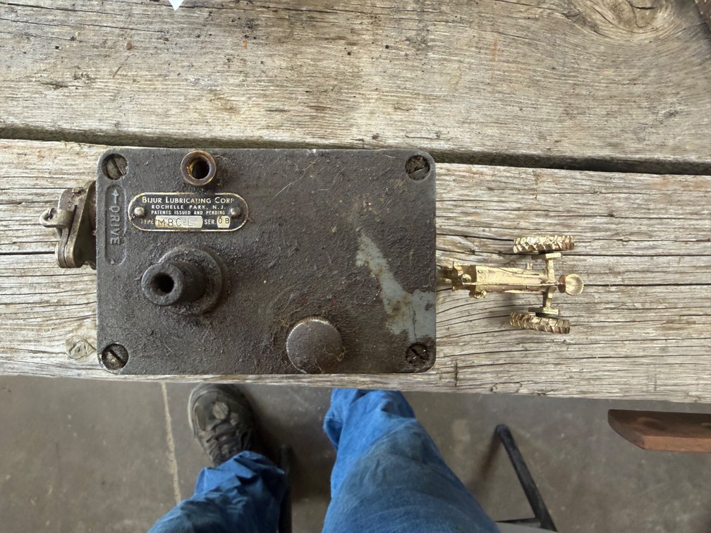 Old Bijur Lubricating Oiler & Miniature Farmall Regular - Item Location: Joel's Tractors and Auction, LLC-33587 Hwy. 13 -Strawberry Point - IA - 52076