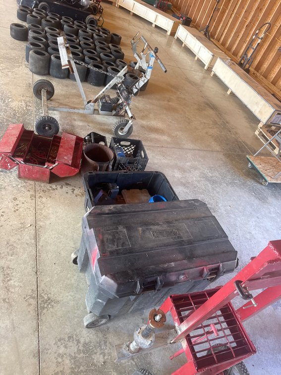 Large lot of performance go, kart parts, helmets, and pitstop equipment