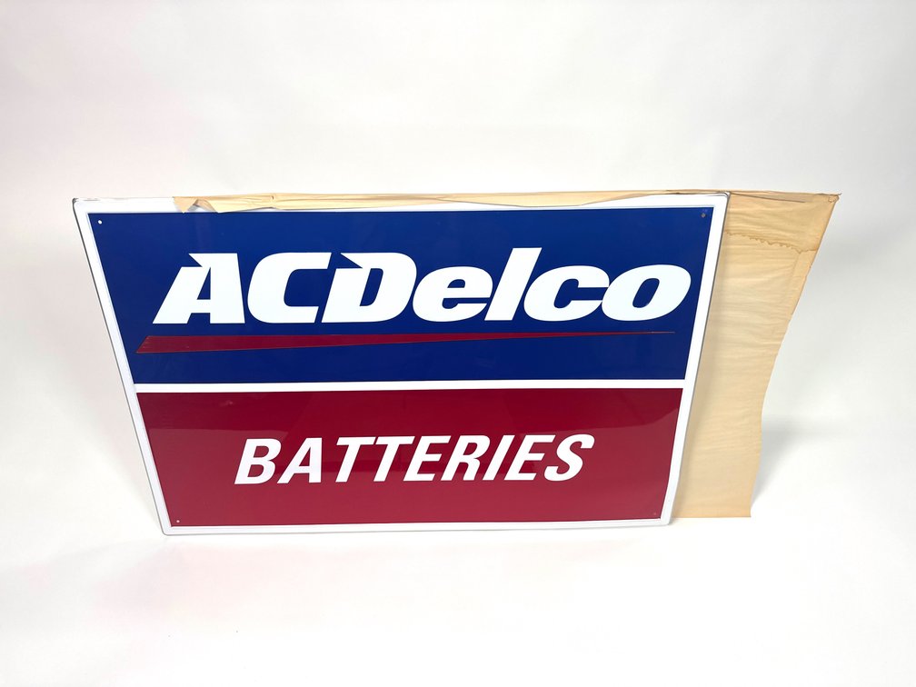NOS vintage AC Delco batteries single-sided tin garage sign.