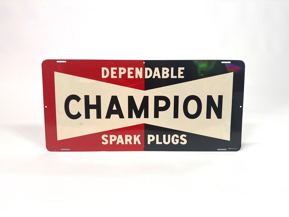 Late 1950s – early 60s Champion Spark Plugs single sided tin garage sign.