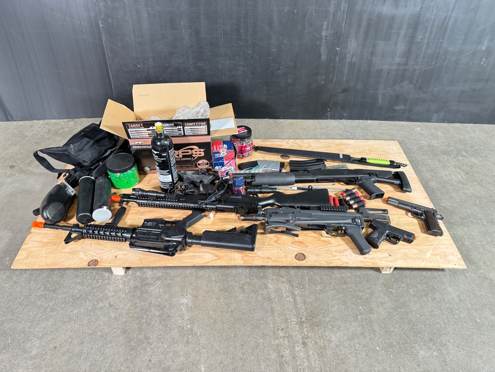 Lot of paintball and airsoft guns with equipment. 