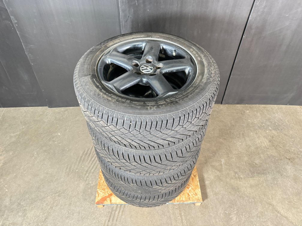 Set of four Volkswagon rims with tires. 
