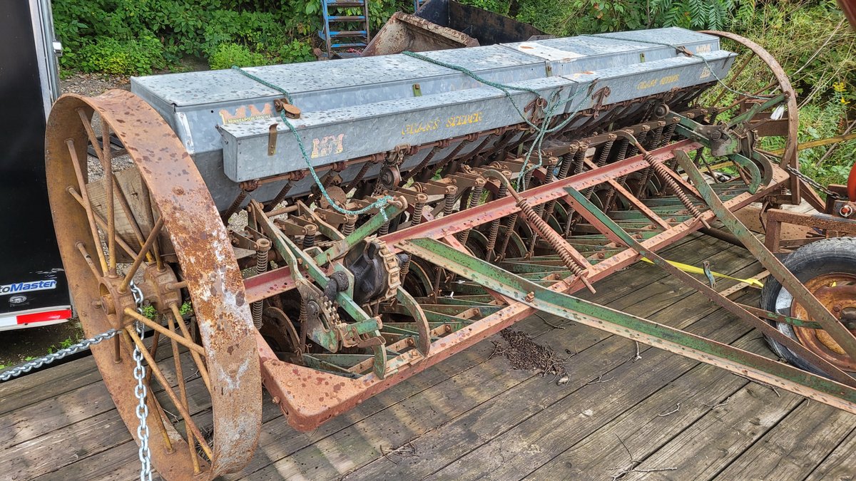 Minneapolis Moline drill with grass seeder.