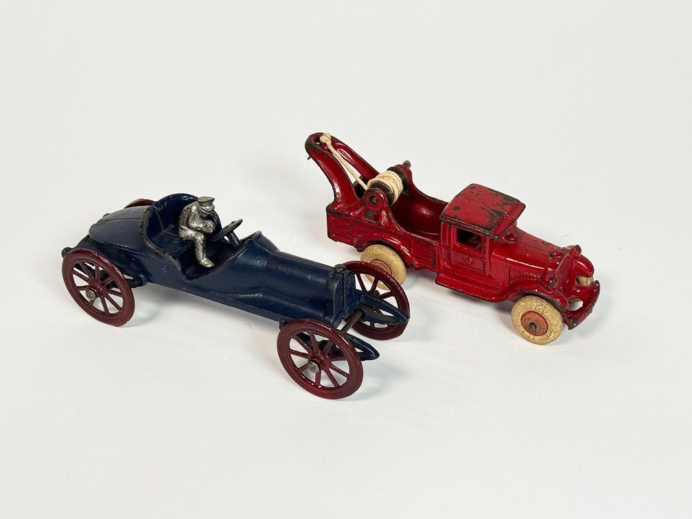 Circa 1920s-30s Hubley Toys cast-iron toy spoked wheel touring car and period tow truck.