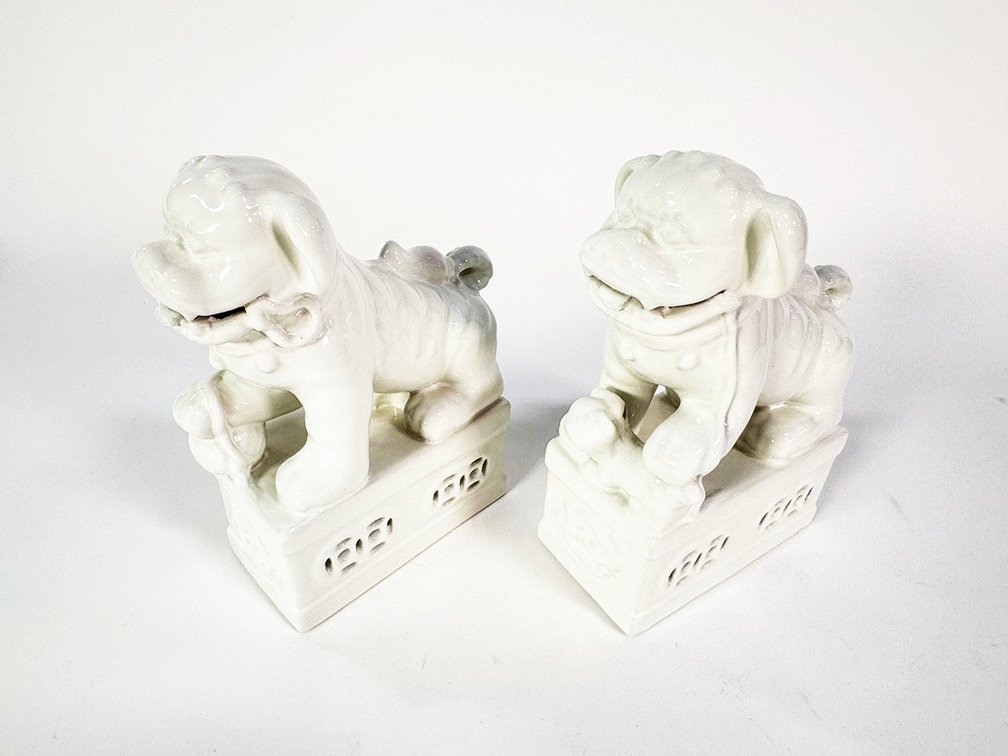 Pair of white porcelain Foo Dogs/ guardian lions. 