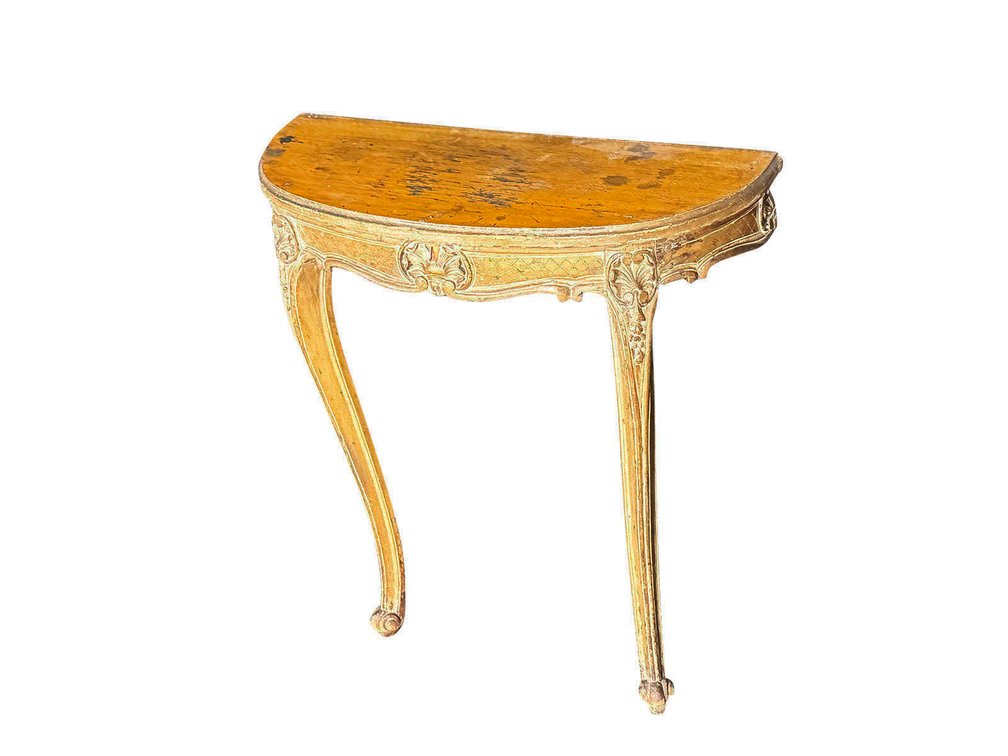 Circa early 19th century carved wood demilune two-legged console table. 