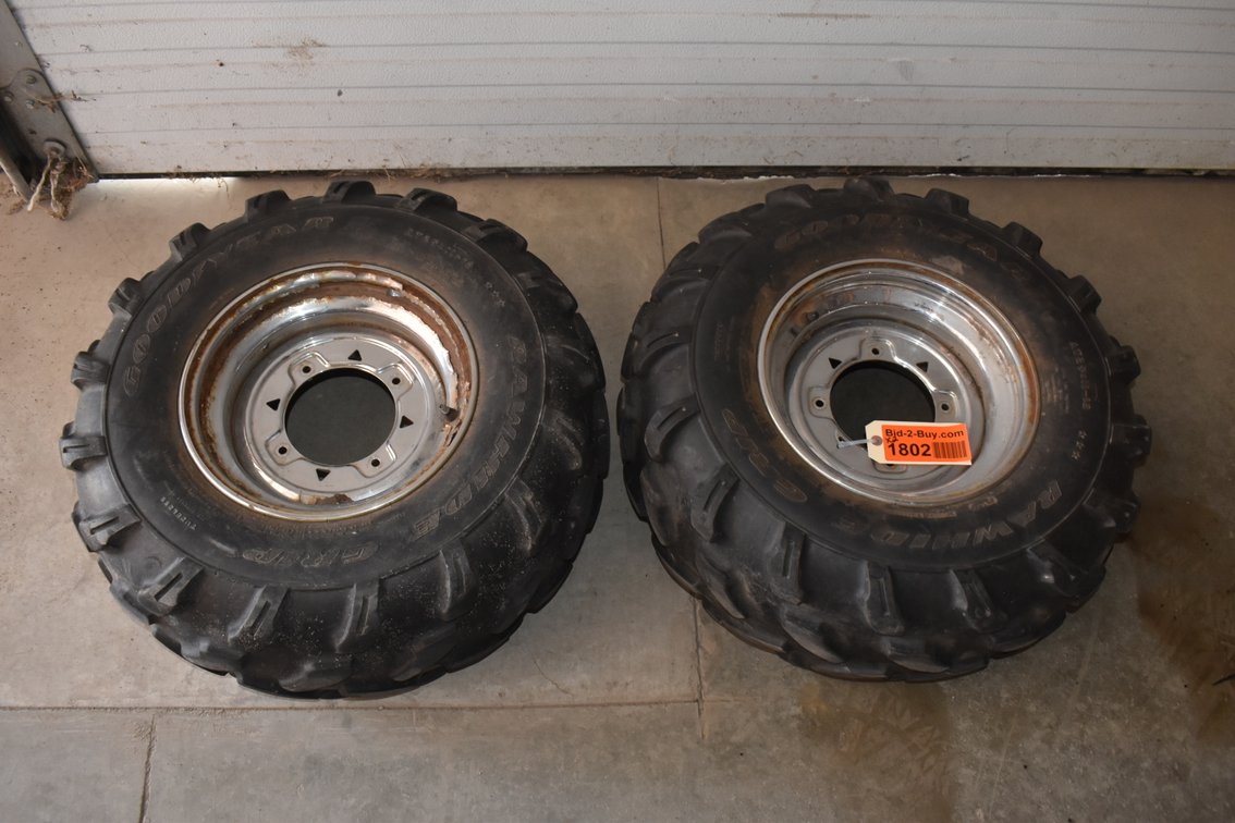 (2) Goodyear Rawhide Grip Tires On Steel Rims