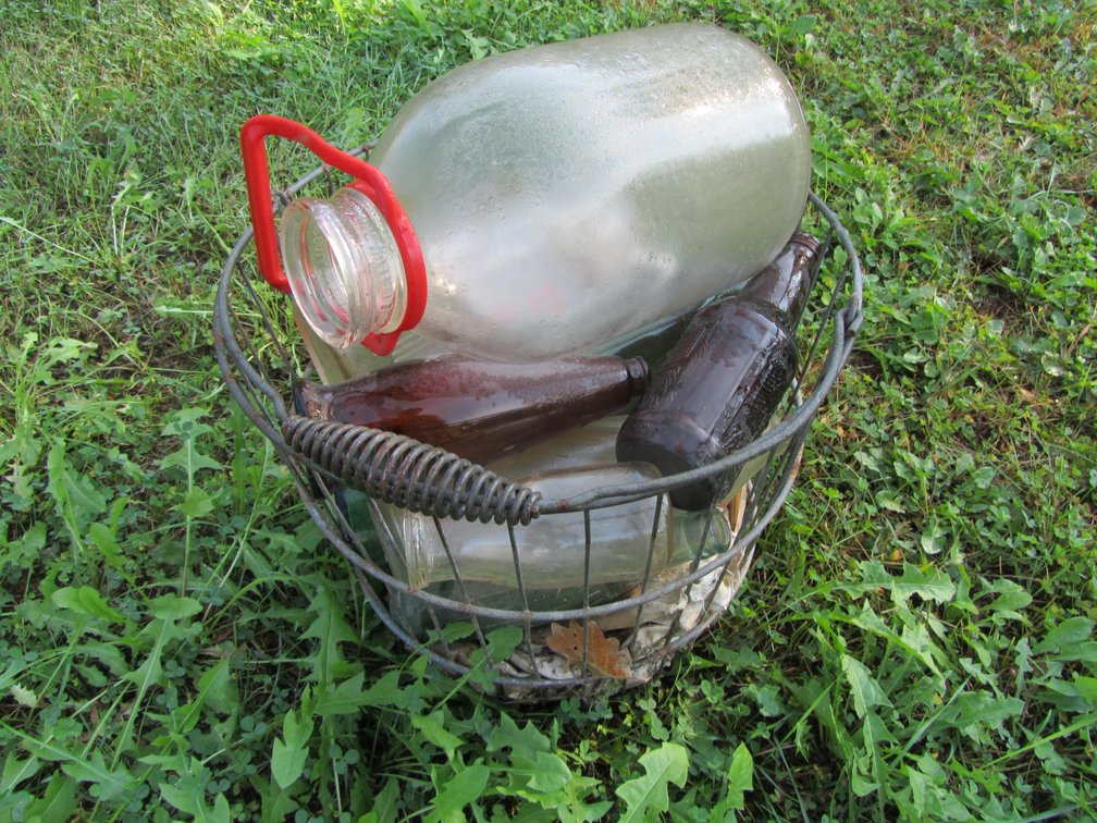 Wire Basket Full Of Vintage Glass Bottles & Jugs