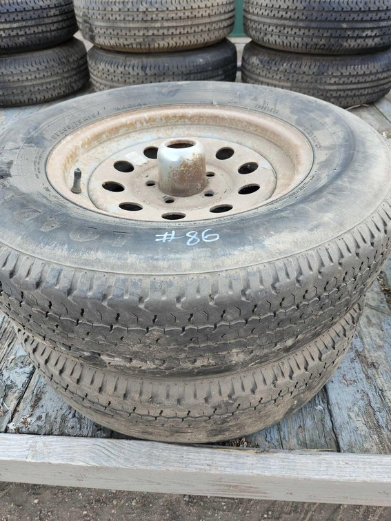 PAIR 205/75R15 TIRES ON 5 ON 4.5 RIMS USED