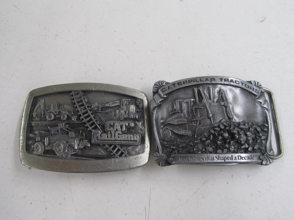 (2) Caterpillar Inc. Metal Belt Buckles