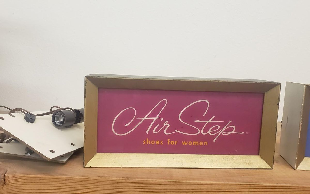 vintage shoe display sign lighted