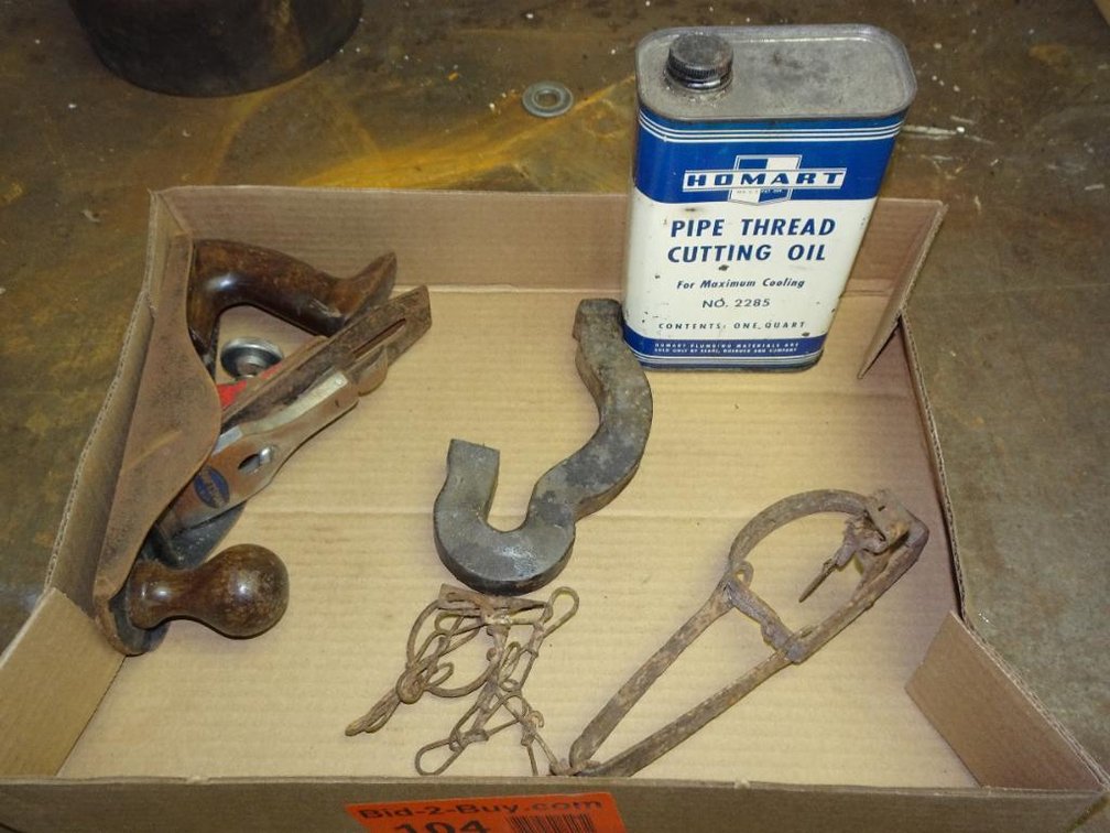 Pipe Threading Cutting Oil With Small Game Foot Trap And A Vintage Hand Plane