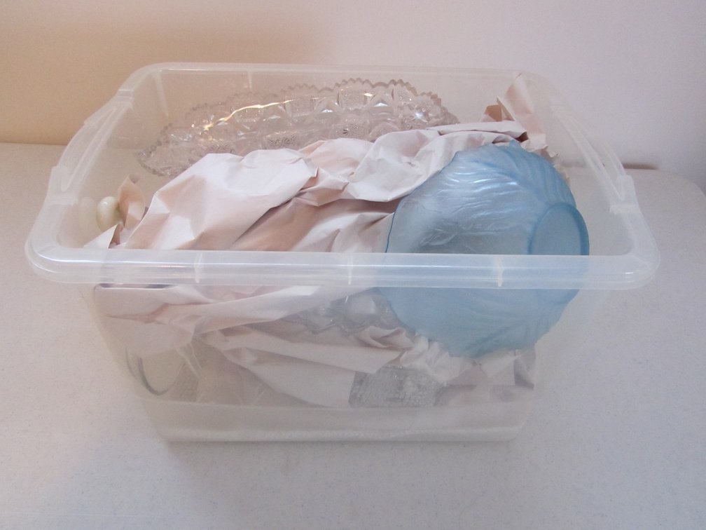 Small Tub Full Of Assorted Glass Serving Bowls And Dishes