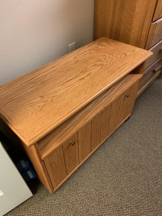 Oak entertainment center on wheels