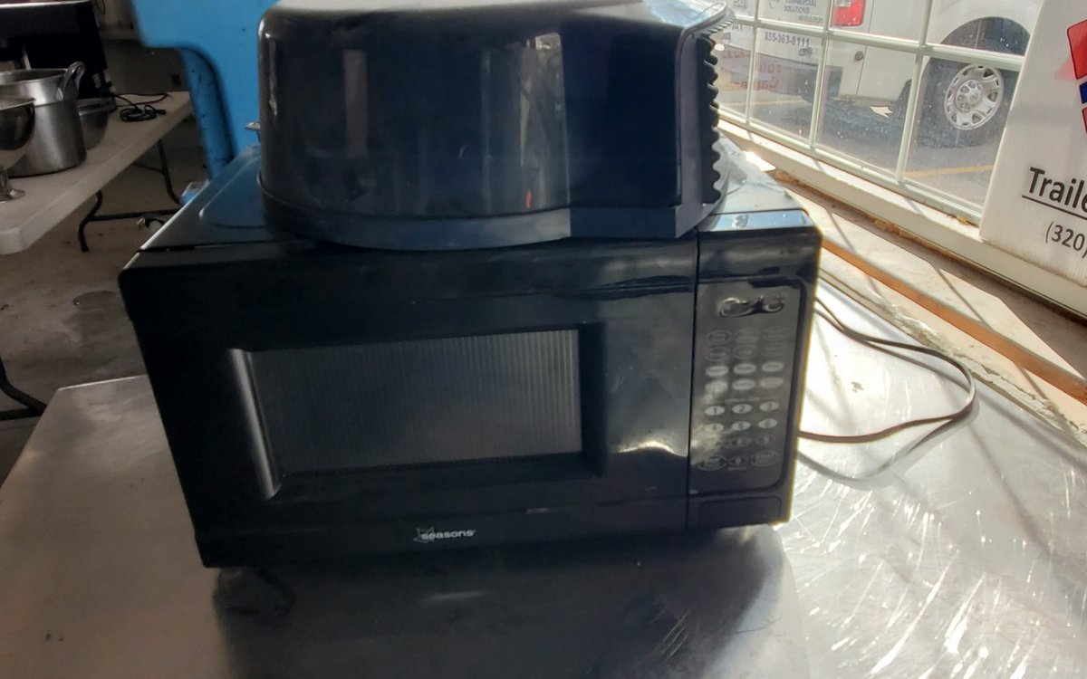 Seasons model no. EM720CNF-PMB microwave and tissue holder