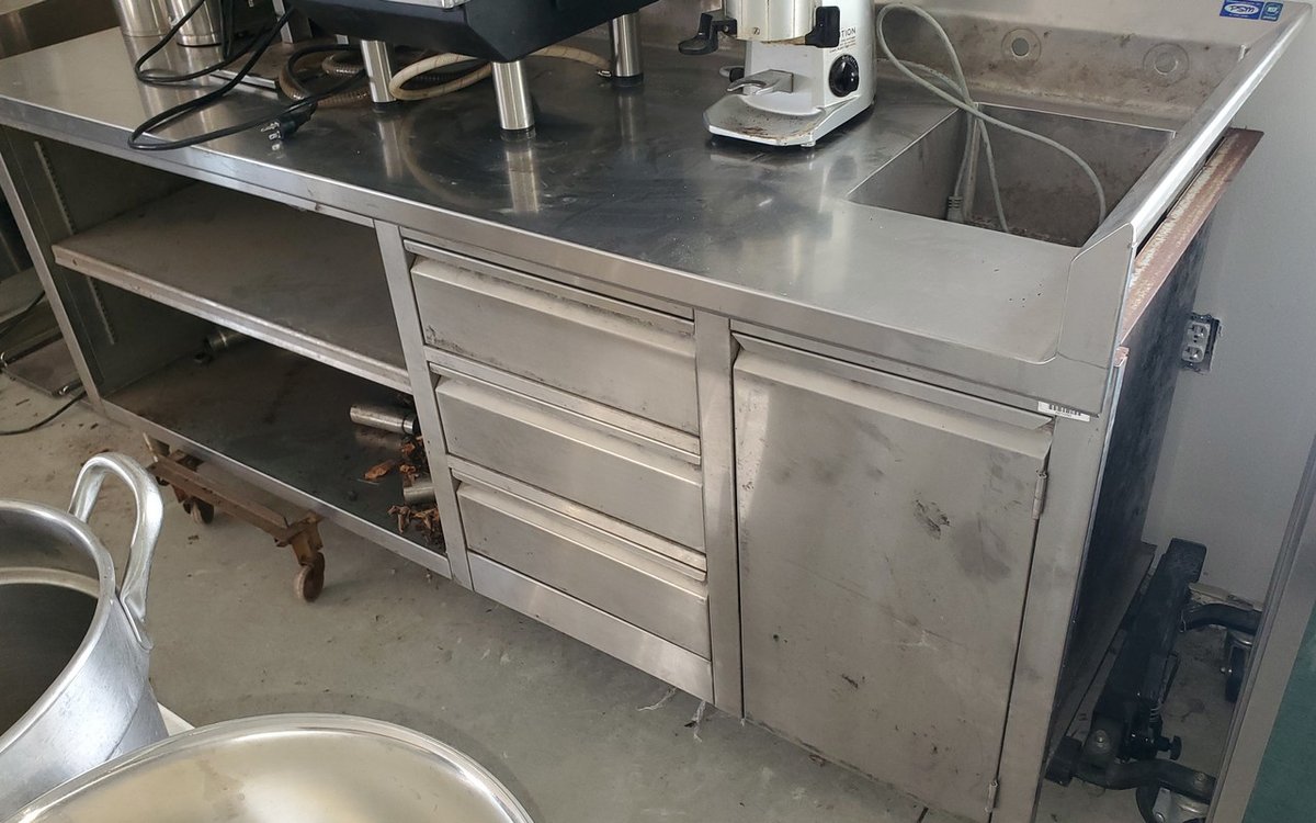 Stainless steel work counter with sink, drawers, shelves and backsplash 84x30"