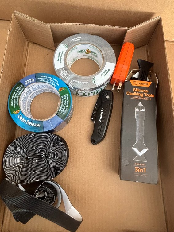 Duck Tape, Painters Tape, Outlet Tester, Husky Knife, and Caulking Tool