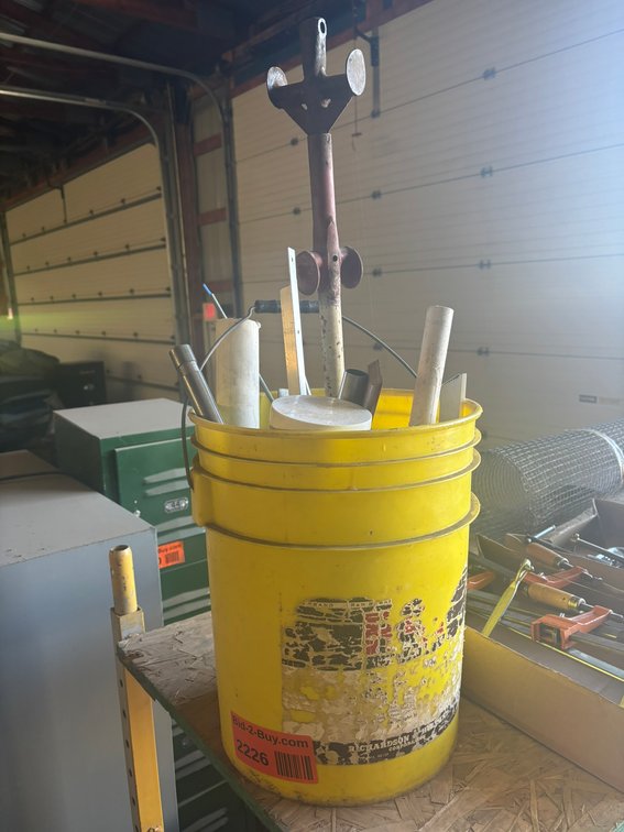 Bucket of Assorted PVC and Pounding Rods