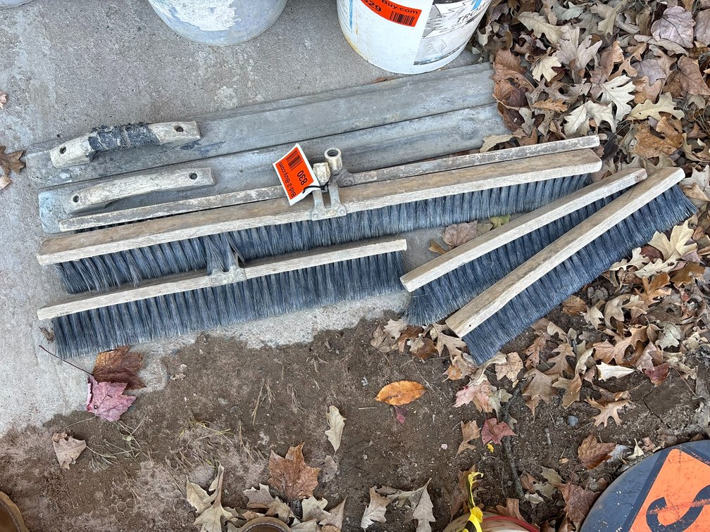 (2) Concrete Darbies and (4) Concrete Brooms