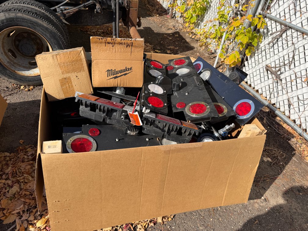 Box of Take-Off Truck Lights & Mounting Brackets