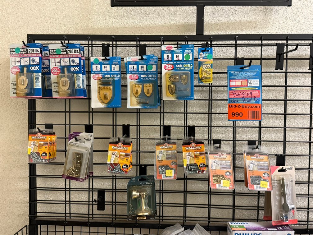 Assorted Hardware Hanging on Back of Rack