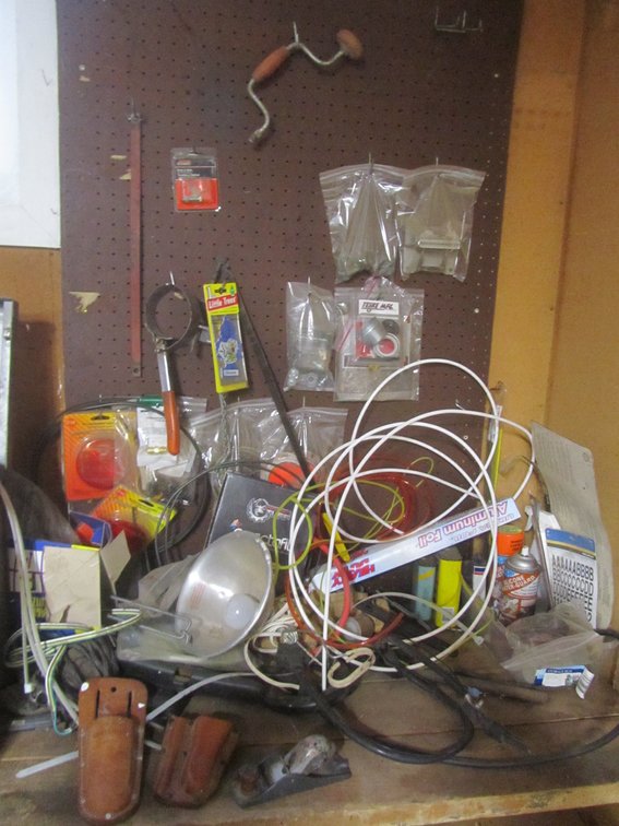 Contents Of Work Bench Top And Pegboard