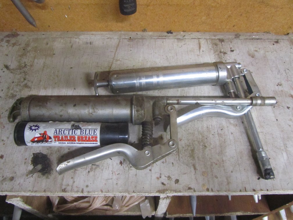 Pair Of Grease Guns