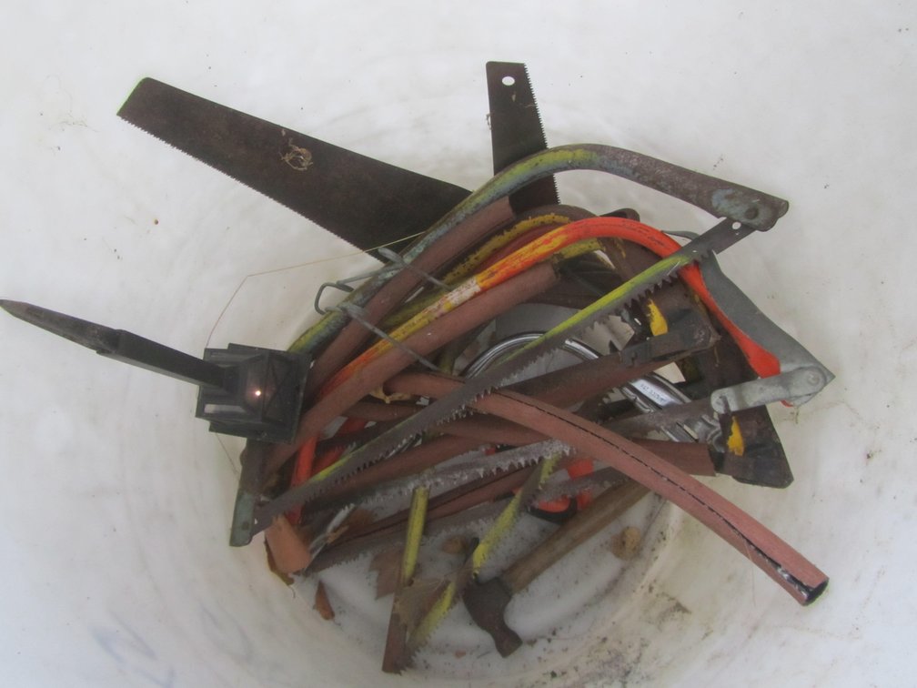 Plastic Barrel w/Assorted Bow Saws And More