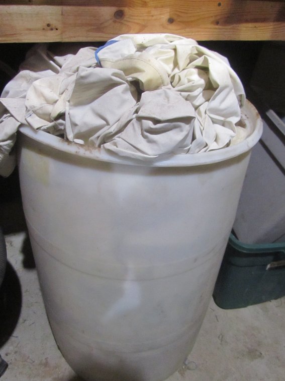 Plastic Barrel Full Of Painter's Tarps