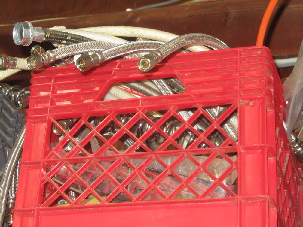 (2) Milk Crates Full Of Braided Water Lines, Shower Heads, Shower Drains, Grab Bars, And More