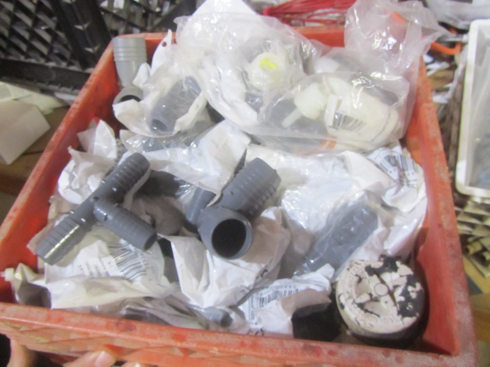 Crate Full Of Plastic Water Line Fittings
