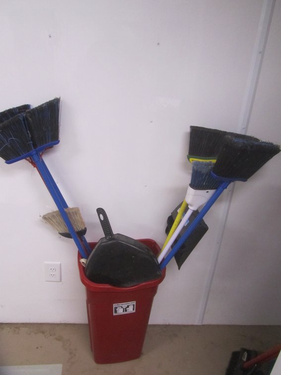 Lot Of Brooms And Dust Pans