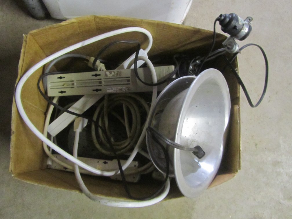 Box Of Power Strips And Work Lights