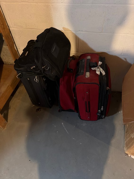 Three suitcases and handbag