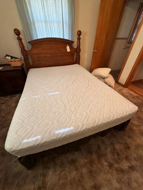 Nice queen size bed with mattress and pillows