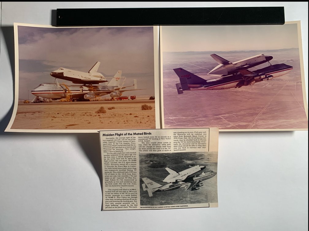 Photos Of the Enterprise On Top Of the Boeing 747, A Photo Of Them In Air, And A Newspaper Clipping About Their Maiden Flight