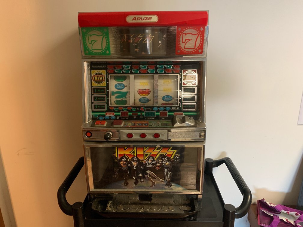 Kiss Slot Machine Made By Aruze Corp. With Tokens